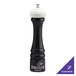 A black Chef Specialties pepper mill with a white top.