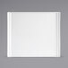 A white rectangular porcelain plate with a white border.
