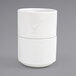 A stack of Front of the House Monaco bright white round porcelain ramekins.