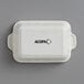 A white rectangular Acopa stoneware casserole dish with black text.
