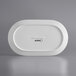 An Acopa Liana bright white porcelain rectangular platter with embossed lines.