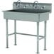 A stainless steel Advance Tabco multi-station hand sink with two faucets.