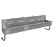 a stainless steel sink with faucets