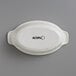 An Acopa vanilla bean stoneware oval baker and casserole dish with black text on the side.