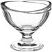 An Acopa clear glass dessert bowl with a curved edge.