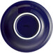 An Acopa Capri deep sea cobalt stoneware fruit bowl with a white rim on a blue plate.