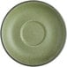 A close-up of an Acopa Embers moss green matte stoneware saucer with a round center.