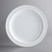 An Acopa Foundations white melamine plate with a narrow white rim.