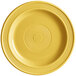 An Acopa Capri citrus yellow stoneware plate with a circular design in the middle.