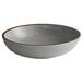 An Acopa Keystone stoneware low bowl with a brown rim and gray speckled interior.