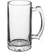 An Acopa clear glass beer mug with a handle.