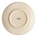An Acopa Keystone 8-inch vanilla bean stoneware coupe low bowl shown from the bottom.