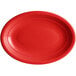 An Acopa Capri passion fruit red oval stoneware coupe platter with a rim.