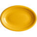 An Acopa Capri mango orange oval platter with a white background.