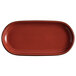 An Acopa Keystone Sedona Orange stoneware oblong coupe platter with black specks.