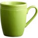 An Acopa Capri green bamboo mug with a handle.