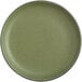 A close up of an Acopa Moss Green Matte Coupe plate.