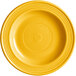 a yellow plate with a circular pattern