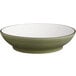 A close-up of an Acopa moss green stoneware pasta bowl with a white rim.