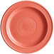 An Acopa Capri stoneware plate in coral with a spiral pattern on the rim.