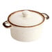 An 8 oz. vanilla bean stoneware mini casserole dish with a lid and two side handles.