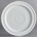 An Acopa Capri white stoneware plate with a circular pattern.