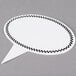 A white speech bubble with a black and white checkered border.