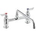 A Waterloo deck-mounted faucet with two red handles.