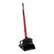 A red and black Libman lobby broom and dustpan.