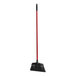 A red and black Libman commercial angle broom with a long handle.
