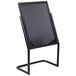 A black Aarco double pedestal poster stand with a black sign on it.