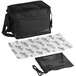 A black Vesture thermal catering bag with a strap and a small cooler inside.