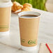 Two EcoChoice brown paper hot cups on a table.