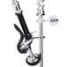 A metal pre-rinse faucet with black and chrome accents and a hose.