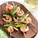 A plate of shrimp and asparagus skewers with EcoChoice wooden skewers.