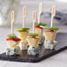 A piece of cheese and apple on a Bamboo by EcoChoice bamboo food pick.