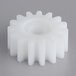 A white plastic gear with a hole for Estella dough sheeters.