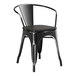 A Lancaster Table & Seating black metal arm chair with black wood seat.