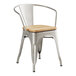 A Lancaster Table & Seating metal chair with a wooden seat.