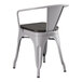 A Lancaster Table & Seating gray metal chair with a black wood seat.