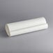 a roll of paper on a gray background