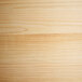 A close up of a natural wood grain surface.