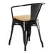 A Lancaster Table & Seating black metal chair with a wooden seat.