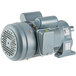 A close-up of a grey electric motor with a round cover.