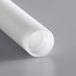 A white cylindrical roller with a hole in it.