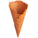 An empty orange Konery Pumpkin Spice waffle cone with a broken top.