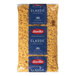 A bag of Barilla Farfalle pasta with white text.