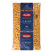 A Barilla bag of Pennoni Rigati pasta with blue and white labels.