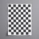 a black and white checkered paper