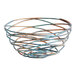 A Front of the House Patina fused iron round basket with a spiral design.